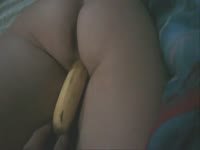 Always horny married woman lays on stomach and takes banana insertion from husband